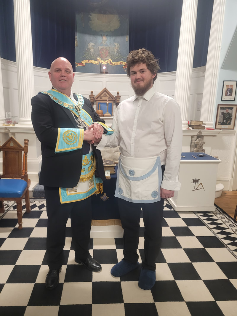 RWM brother john niven congratulating brother evan blackburn on becoming a master mason