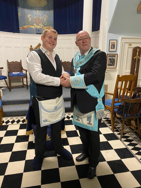 the rwm brother jock wishart of lodge st andrew at crail no.83 congratulating brother tyler graham